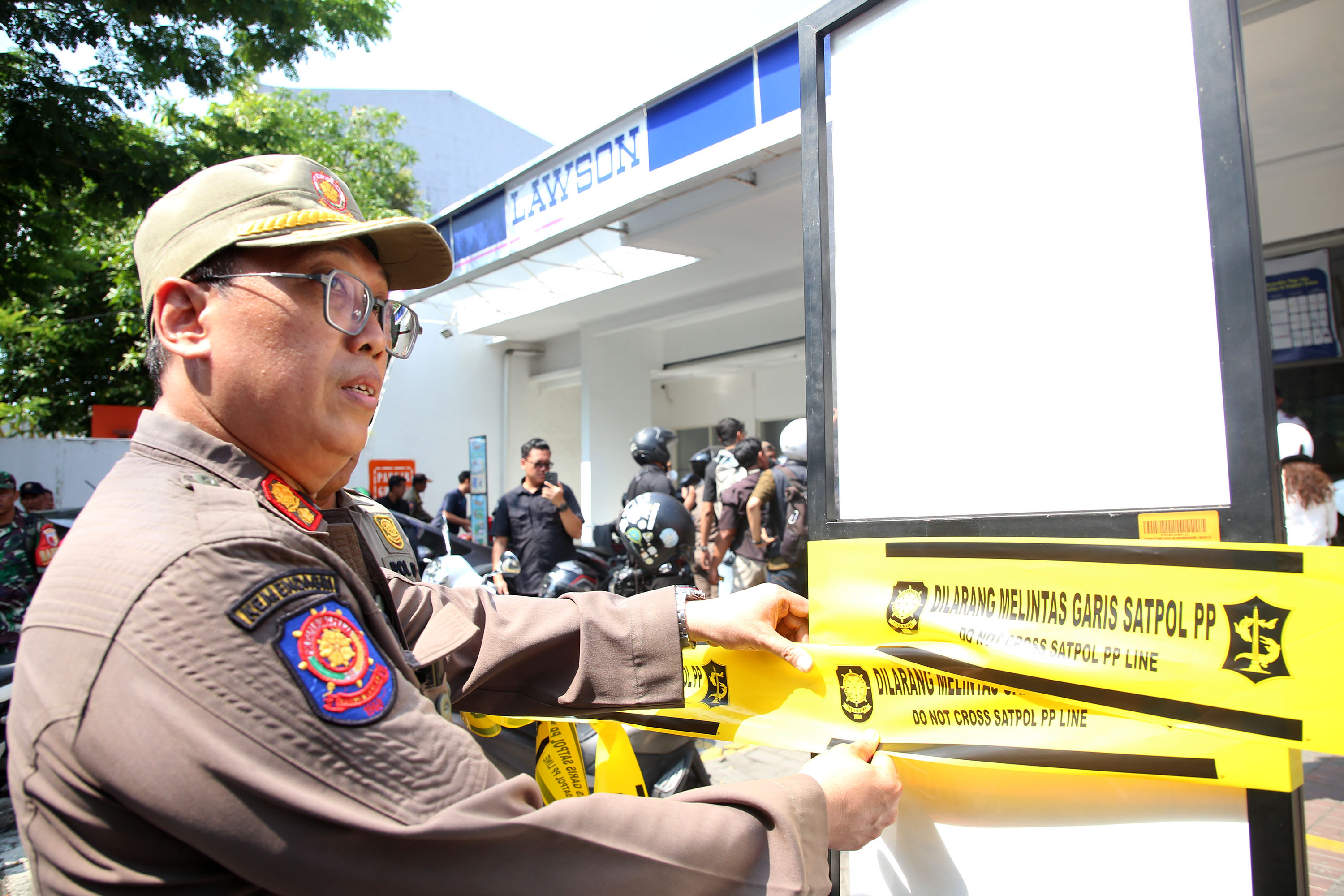 LHKP PDM Surabaya Tentang Penertiban Juru Parkir Liar di Toko Modern